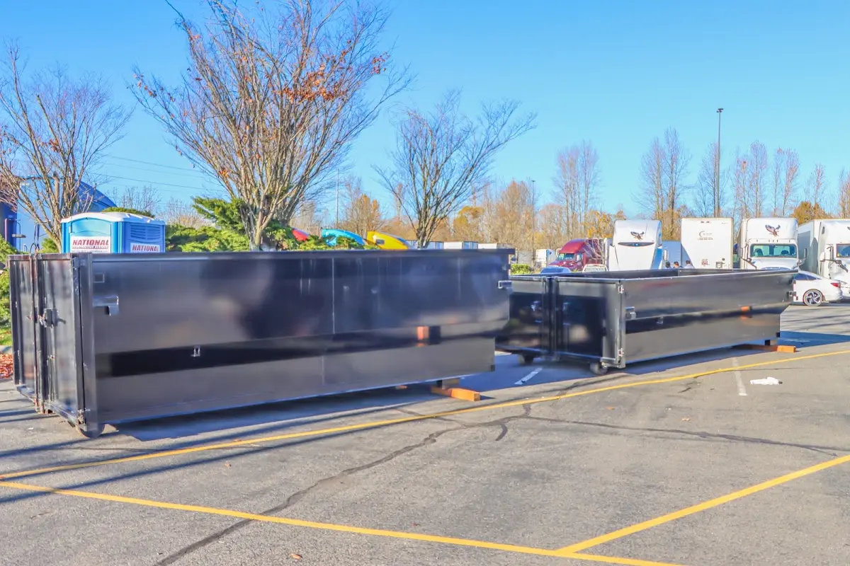 Professional dumpster rental service with roll-off container on residential driveway in Wekiwa Springs