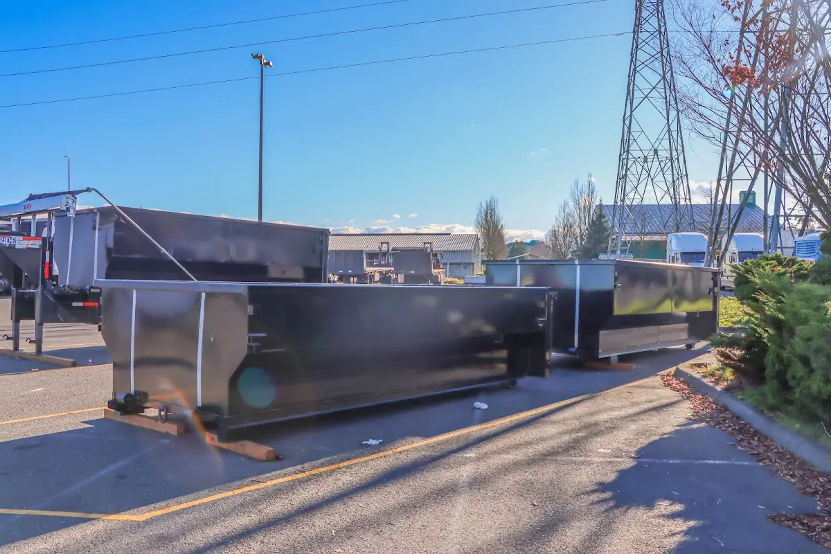 Roll-off dumpster ready for waste disposal at job site for 2 Yard Dumpster Rental in Wekiwa Springs